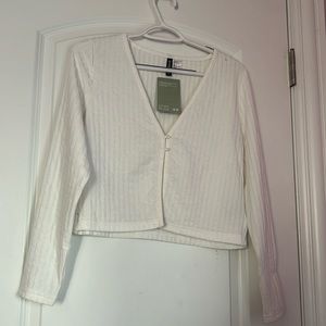 White cardigan. NEVER worn. Very soft and stretchy.